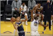  ?? EZRA SHAW — GETTY IMAGES, FILE ?? The Nuggets’ Michael Porter Jr. looks to pass around the Warriors’ Andrew Wiggins during their preseason game at Chase Center last Saturday in San Francisco.