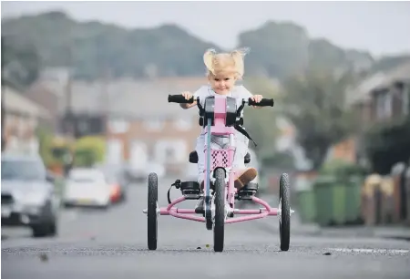  ??  ?? Rubie O’Brien tries out her new trike.