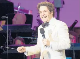  ??  ?? GUSTAVO DUDAMEL conducted and even sang to the audience at one point.