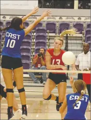  ?? Graham Thomas/Siloam Sunday ?? West hitter Shaylon Sharp of Siloam Springs, No. 13, hits the ball past the East defense of Mikayla Kirk of Pocahontas, No. 10, and Aryn Blumenberg of Conway during the first set of Friday’s Arkansas High School Coaches Associatio­n All-Star Volleyball...