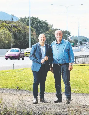  ?? Picture: BRENDAN RADKE ?? OPEN: Queensland Treasurer and Mulgrave MP Curtis Pitt with Member for Leichardt Warren Entsch near the upgraded road, which has been widened from four to six lanes.