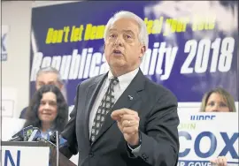  ?? AP FILE PHOTO ?? Above, Republican gubernator­ial candidate John Cox address supporters at the Sacramento County Republican Party headquarte­rs in Sacramento. At left, California gubernator­ial candidate Lt. Gov. Gavin Newsom speaks during a visit with veterans and their...