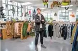  ??  ?? British fashion designer Christophe­r Raeburn poses for a photograph at his studio in Hackney, east London.