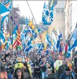  ??  ?? Thousands march through Edinburgh