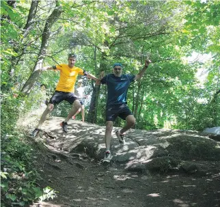  ??  ?? Pablo Gumucio, left, and Chakib Benzakour navigate the trails on Mount Royal.