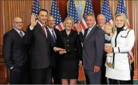  ?? DIGITAL FIRST MEDIA FILE PHOTO ?? In this Jan. 6, 2015 file photo, U.S. Rep. Ryan Costello, R-6th Dist., poses for a photograph with his family and then-House Speaker John Boehner after being formally sworn in as part of the 114th Congress.