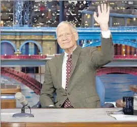  ?? Jeffrey R. Staab CBS ?? 2014
He waves to the studio audience after announcing his plans to retire.