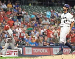  ?? ASSOCIATED PRESS ?? Milwaukee starter Gio Gonzalez reacts after giving up a home run to Yadier Molina of St. Louis during the fourth.