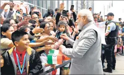  ?? ?? Prime Minister Narendra Modi greets the Indian community, in Copenhagen on Tuesday.
