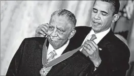  ?? CHIP SOMODEVILL­A/GETTY 2009 ?? President Barack Obama presents the Presidenti­al Medal of Freedom to Joseph Lowery.