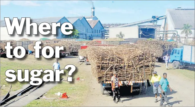  ?? Picture: REINAL CHAND/FILE ?? Sugarcane truck drivers wait to unload cane at the Lautoka Mill.