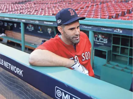  ?? AP ?? The Red Sox's J.D. Martinez speaks to a reporter during a workout at Fenway Park on Friday.