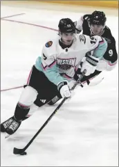  ?? MARTA LAVANDIER/AP ?? PACIFIC DIVISION’S TROY TERRY, OF THE ANAHEIM DUCKS (19) works against Central Division’s Clayton Keller, of the Arizona Coyotes (9).