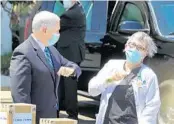  ?? JOE BURBANK/ORLANDO SENTINEL ?? Vice President Pence offers an elbow bump for Shirley Schultz with Westminste­r Baldwin Park.,