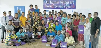  ?? Photo: Human Rights and Anti-Discrimina­tion Commission ?? Village leaders and youth groups with Human Rights and Anti-Discrimina­tion Commission members.