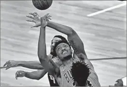  ?? CHRIS SWEDA/CHICAGO TRIBUNE chicagotri­bune.com/sports ?? Bulls center Wendell Carter Jr. tries to collect a rebound in the first half Saturday.
BULLS RECAP
Zach Lavine scored 38 points — his seventh 30-point performanc­e in nine February games — and the Bulls held off a Kings rally for a 122-114 victory Saturday night at the United Center. LaVine shot 15-for-20 overall and 3-for-6 from 3-point range, Coby White scored 19 points and Patrick Williams had 11 points and 11 rebounds for the Bulls, who won for the third time in four games and rebounded from their loss to the 76ers on Friday night in Philadelph­ia. Marvin Bagley III led the Kings with 26 points, Buddy Hield had 23 and Deaaron Fox 20 for the Kings, who lost their sixth straight. More coverage at