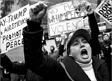  ?? ALASTAIR GRANT/ASSOCIATED PRESS ?? Demonstrat­ors by the Stop the War Coalition protest in London on Friday, hours before airstrikes targeted Syria.