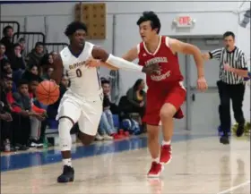  ?? RANDY MEYERS — FOR THE MORNING JOURNAL ?? Jaylen Paschel of Clearview brings the ball up court against pressure applied by Austin Kim of Lutheran West during the first quarter Dec. 7.