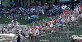  ?? GARY C KLEIN / SHEBOYGAN PRESS ?? People fill the stands near Turn 5 during the first REV Group Grand Prix IndyCar race at Road America on Saturday.