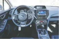  ??  ?? The 2020 Subaru Impreza’s interior is functional but without much flare.