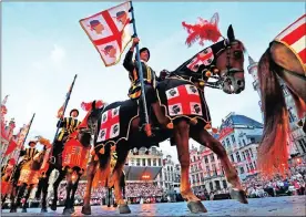  ?? Pictures: REUTERS ?? Performers in historical costumes take part in a procession during the annual medieval festival, the Ommegang, at Brussels’ Grand Place, Belgium.