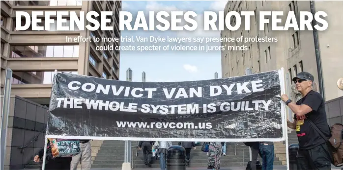  ?? ASHLEE REZIN/SUN-TIMES ?? Protesters from the Revolution Club march and chant on Monday outside the Leighton Criminal Court Building during jury selection in the Jason Van Dyke murder trial.