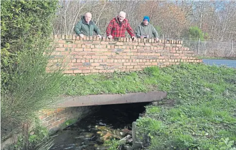  ??  ?? PROTECTION: John Laing, Dave Murray and Jim Rankin at the Lochty Burn in Kinglassie. Picture by Gareth Jennings.