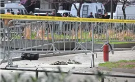  ?? ANGELA WEISS/AFP VIA GETTY IMAGES ?? Fire extinguish­ers are left at the park across from Manhattan Criminal Court in New York City after a man reportedly set himself on fire during the trial of former President Donald Trump on Friday. The man did not make clear his motive outside the courthouse, according to published reports.