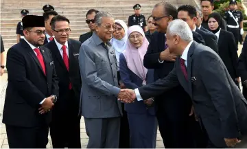  ??  ?? Dr Mahathir greets Attorney-General Tommy Thomas at the monthly assembly of the Prime Minister’s Department. — Bernama photo