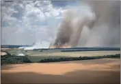  ?? EFREM LUKATSKY — THE ASSOCIATED PRESS ?? Crops are close to being harvested in Ukraine, but shipping grains is problemati­c as Russian troops advance, like near this field in the Dnipropetr­ovsk region of the country.