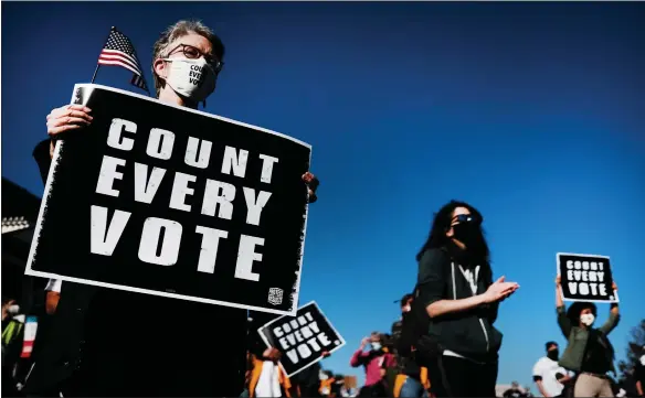  ??  ?? Protesters in Philadelph­ia march in support of counting all ballots as the election result in Pennsylvan­ia remained unresolved with votes still being tallied last night