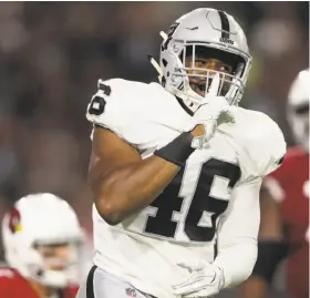  ?? Christian Petersen / Getty Images ?? Raiders rookie LaTroy Lewis, an undrafted linebacker from Tennessee, reacts after sacking the Cardinals’ Blaine Gabbert in the second half Saturday. Lewis had two of Oakland’s four sacks.