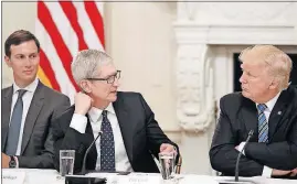  ?? [ALEX BRANDON/THE ASSOCIATED PRESS] ?? Tim Cook, center, Apple’s chief executive officer, speaks to President Donald Trump during a technology roundtable Monday in the White House. Looking on is White House senior adviser Jared Kushner.