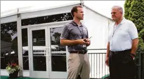  ?? Pat Eaton-Robb / Associated Press ?? Nathan Grube, left, the director of the Travelers Championsh­ip golf tournament, and Andy Bessette, executive vice president of Travelers, chat at the ALS Center of Excellence at TPC River Highlands in Cromwell in 2017. The center is designed to let patients with ALS attend the PGA Tour event. Bessette is being inducted into the Connecticu­t Golf Hall of Fame on Monday.