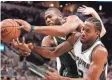  ?? SOOBUM IM / USA TODAY SPORTS ?? Greg Monroe and Kawhi Leonard battle for a rebound.