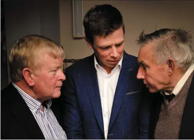  ??  ?? West Kerry Board Chairman Muiris Ó Fiannachta, and Danny MacGearail­t (right) talking football with Tomás Ó Sé at the Lios Póil annual dinner and medal presentati­on night in the Skellig Hotel on Saturday.