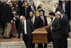  ?? MATT ROURKE — THE ASSOCIATED PRESS ?? A casket is carried out of Rodef Shalom Congregati­on after the funeral services Tuesday for brothers Cecil and David Rosenthal in Pittsburgh.