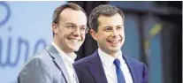  ?? MATT ROURKE/AP ?? Democratic presidenti­al candidate and former South Bend, Ind., Mayor Pete Buttigieg, right, and his husband, Chasten Buttigieg, acknowledg­e the audience at the end of a campaign event in Milford, N.H., on Feb. 10, 2020.