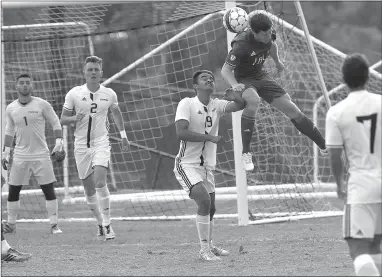  ?? Photo courtesy of Little Joe Photograph­y ?? John Brown junior forward Conner Haney heads the ball in the Golden Eagles’ 2-2 draw against Texas Wesleyan on Saturday in Fort Worth, Texas.