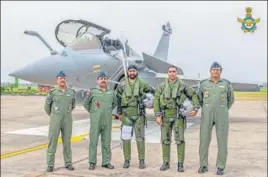  ?? PTI ?? ■
Air Chief Marshal RKS Bhadauria with Rafale pilots at the Air Force Station in Ambala on Wednesday.