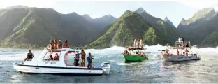  ??  ?? Spectators gather on ‘taxi boats’ as they prepare to watch surfers in action at Teahupoo off the coast of Tahiti in French Polynesia. – AFP