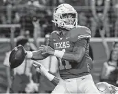  ?? Chuck Burton / Associated Press ?? Texas quarterbac­k Casey Thompson was 15 of 18 for 164 yards with two touchdown passes against Rice.