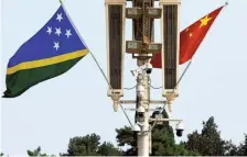  ?? FILE PHOTO ?? Regional ambitions: Flags of Solomon Islands and China flutter near the Tiananmen Gate in Beijing in China.