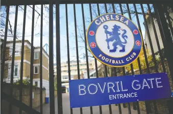  ?? ISABEL INFANTES/AFP VIA GETTY IMAGES ?? The gate at Stamford Bridge stadium, home of the Chelsea Football Club, was closed on Friday after the English Premier League suspended all matches until April 4. Arsenal manager Mikel Arteta and Chelsea winger Callum Hudson-odoi have tested positive for coronaviru­s.