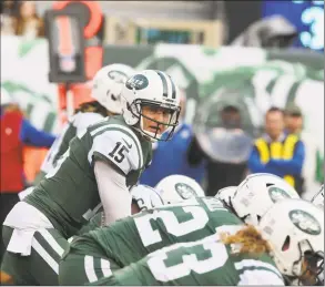  ?? Al Pereira / Getty Images ?? Jets QB Josh McCown lines up against the Patriots on Nov. 25 in East Rutherford, N.J. McCown annoucned his retirement on Monday.