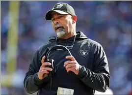  ?? JOHN MUNSON / AP ?? Raiders head coach Rich Bisiaccia talks to an official during the first half of Sunday’s game against the Giants in East Rutherford, N.J.