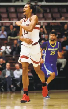  ?? Scott Strazzante / The Chronicle ?? Stanford’s Oscar da Silva celebrates one of his 3-pointers in a 78-73 win over San Jose State at Maples Pavilion on Dec. 18.