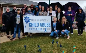  ?? PHOTO PROVIDED ?? Representa­tives from the Bowen Center, Fulton County Department of Child Services and Marshall County Department of Child Services stand in the Pinwheel Garden at the Bowen Center in Plymouth. April was Child Abuse Awareness and Prevention Month.