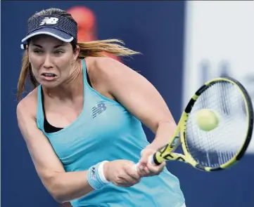  ?? CHARLES TRAINOR JR. ctrainor@miamiheral­d.com ?? American Danielle Collins hits a backhand in her 6-3, 6-3 victory over France’s Kristina Mladenovic during a first-round singles match of the Miami Open at Hard Rock Stadium in Miami Gardens on Wednesday.