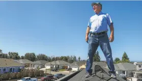 ?? Lacy Atkins / Special to The Chronicle ?? Bob Cipolla on the roof of his home being constructe­d in Santa Rosa, which is completely electric and solarpower­ed with the help of Sonoma Clean Power.